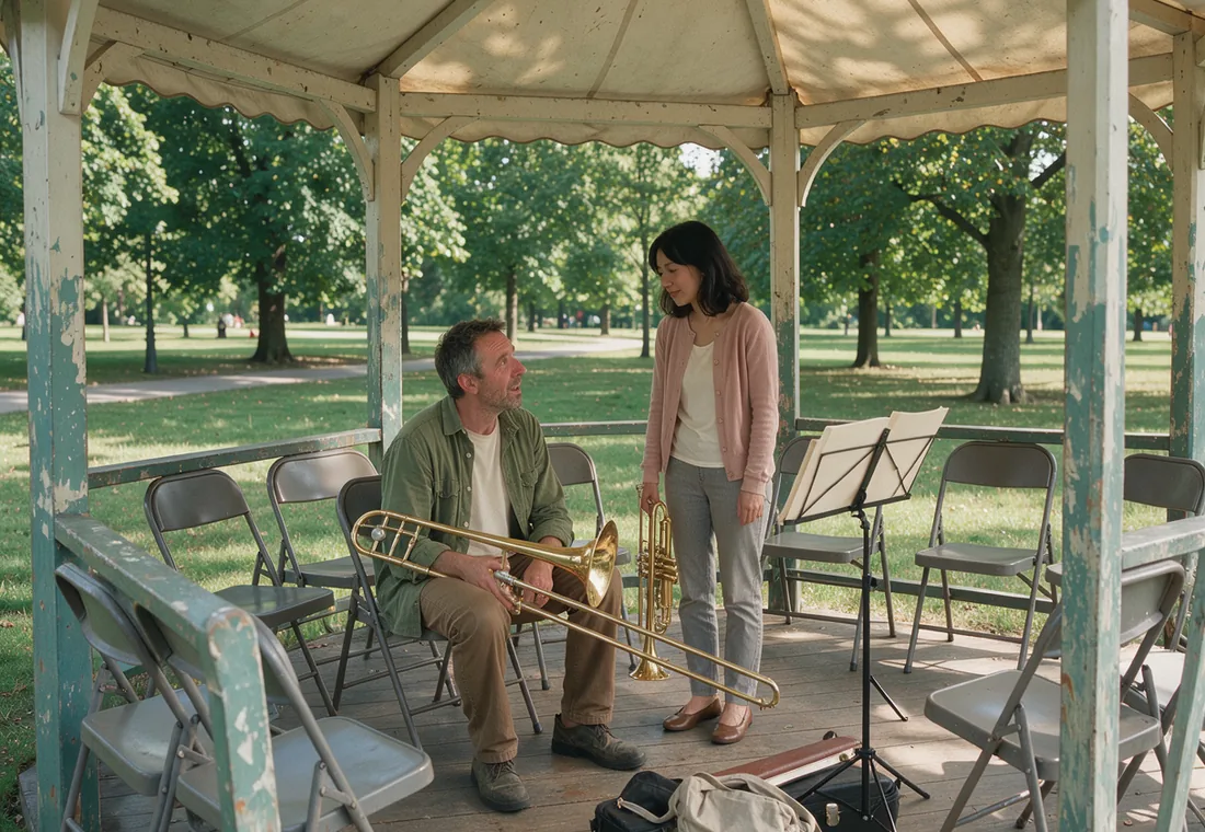Two casually dressed brass players talking during a break at a public bandstand